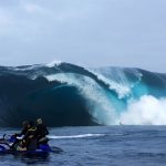 Russell Ord Diving under wave-Photo Gordon Becker